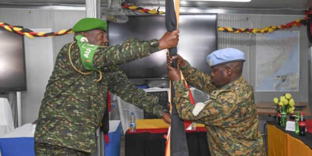 1772358114Lt-Gen-Sam-Kavuma-hands-over-the-uganda-flag-to-Lt-Col-Nather-Akankunda.jpg-1044x522